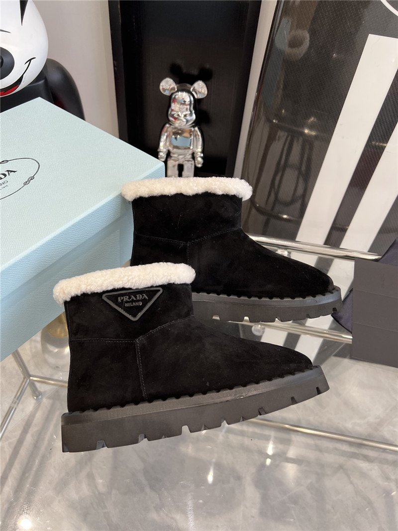 Pra*a triangle-logo suede boots in black
