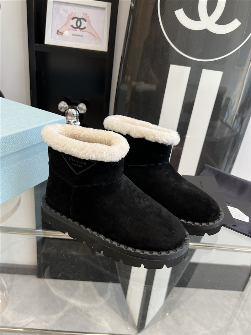 Pra*a triangle-logo suede boots in black