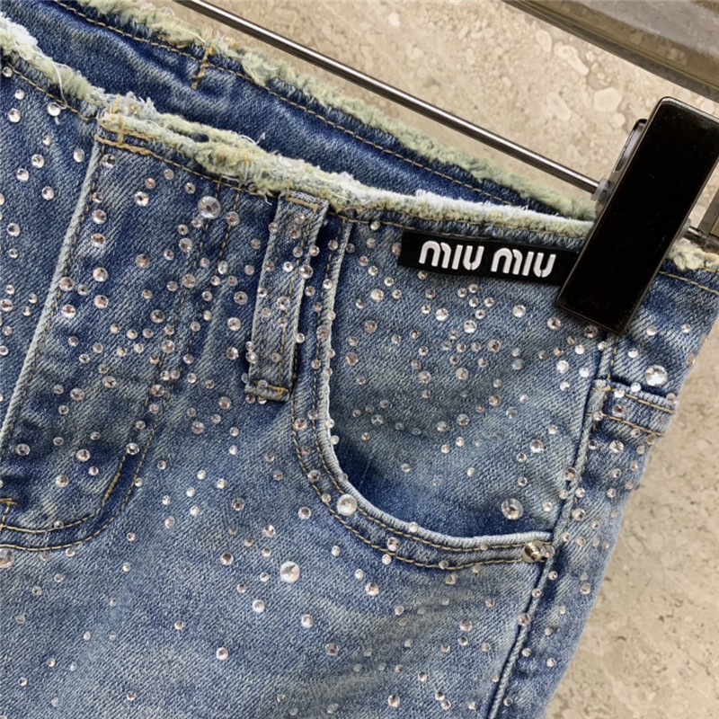 M1um1u micro logo embellished bootcut jeans