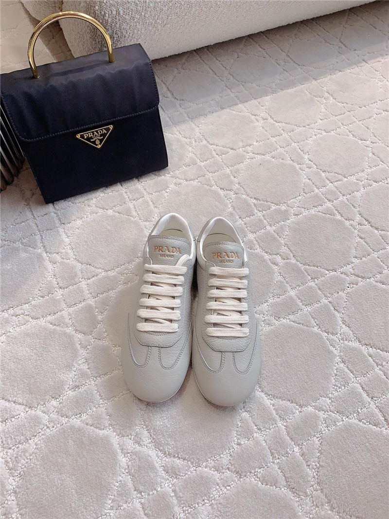 Pra*a triangle logo sneakers in gray