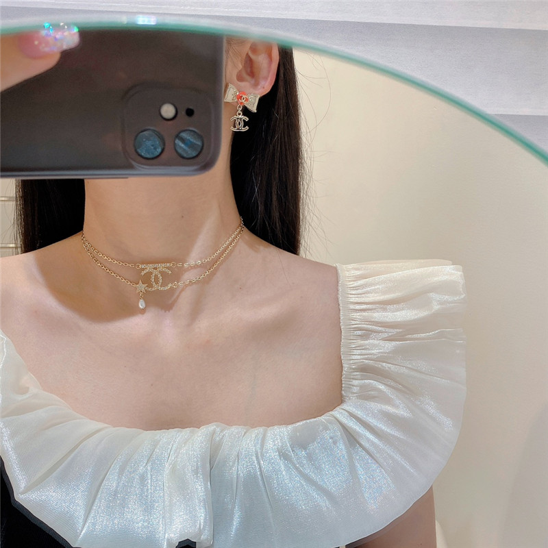 Ch**el orange bow engraved earrings