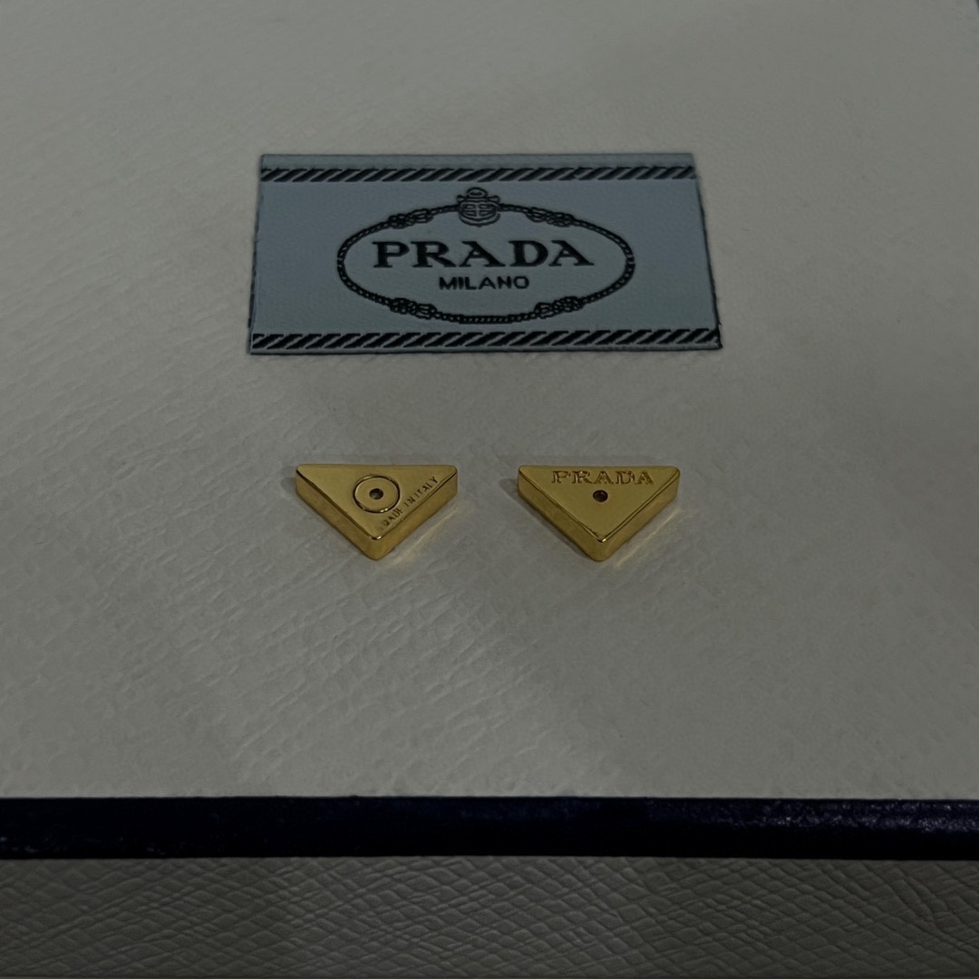 Pra*a triangle earrings