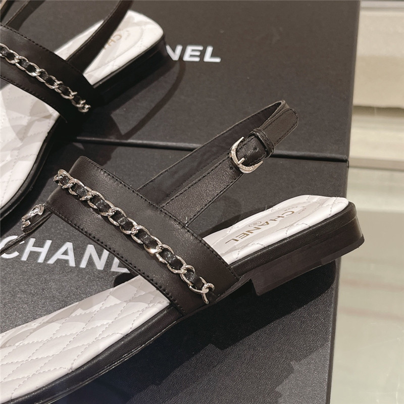 Ch**el quilted t-strap chain flat sandals black and white