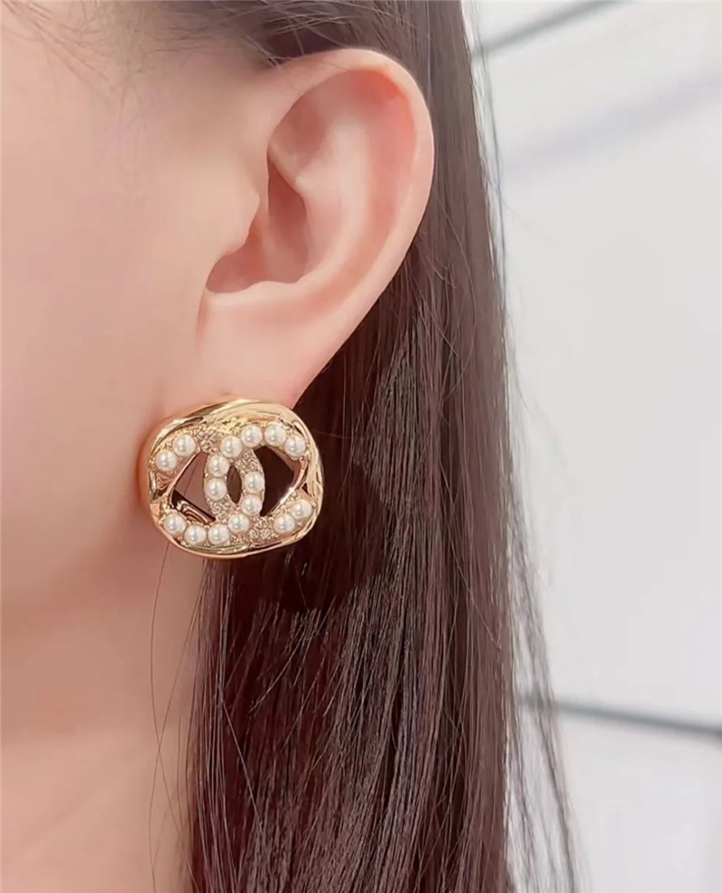 Ch**el hollow twisted sugar cube earrings