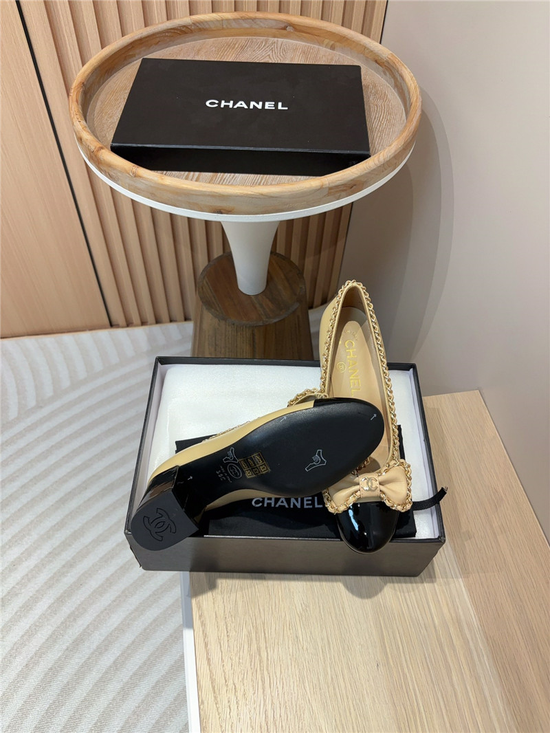 Ch**el bow chain trim ballet pumps in beige and black leather