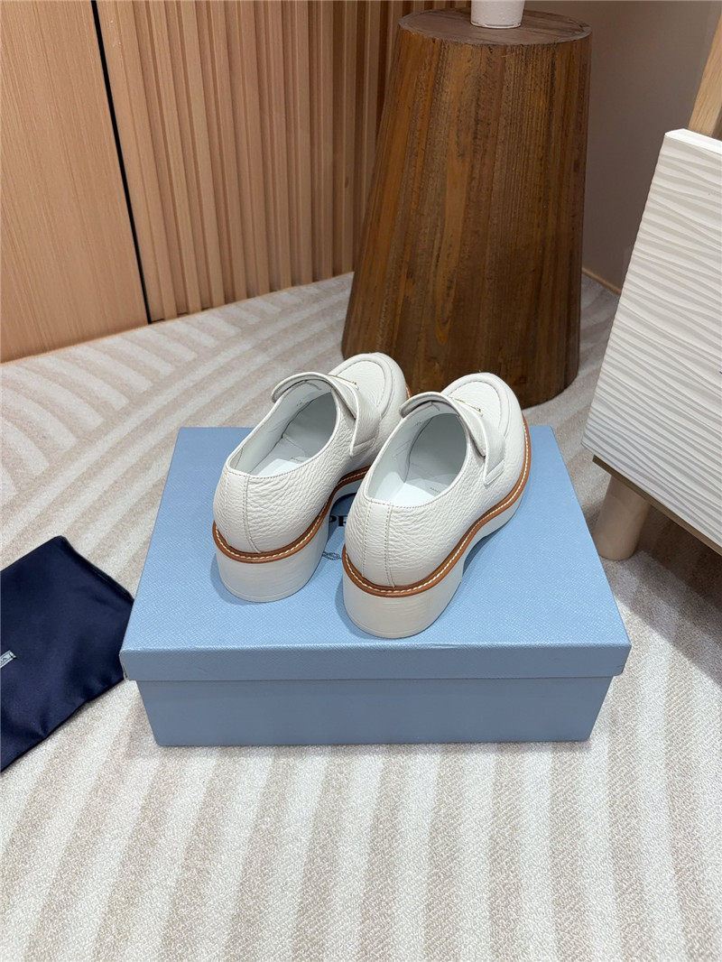 Pra*a white double chocolate leather loafers