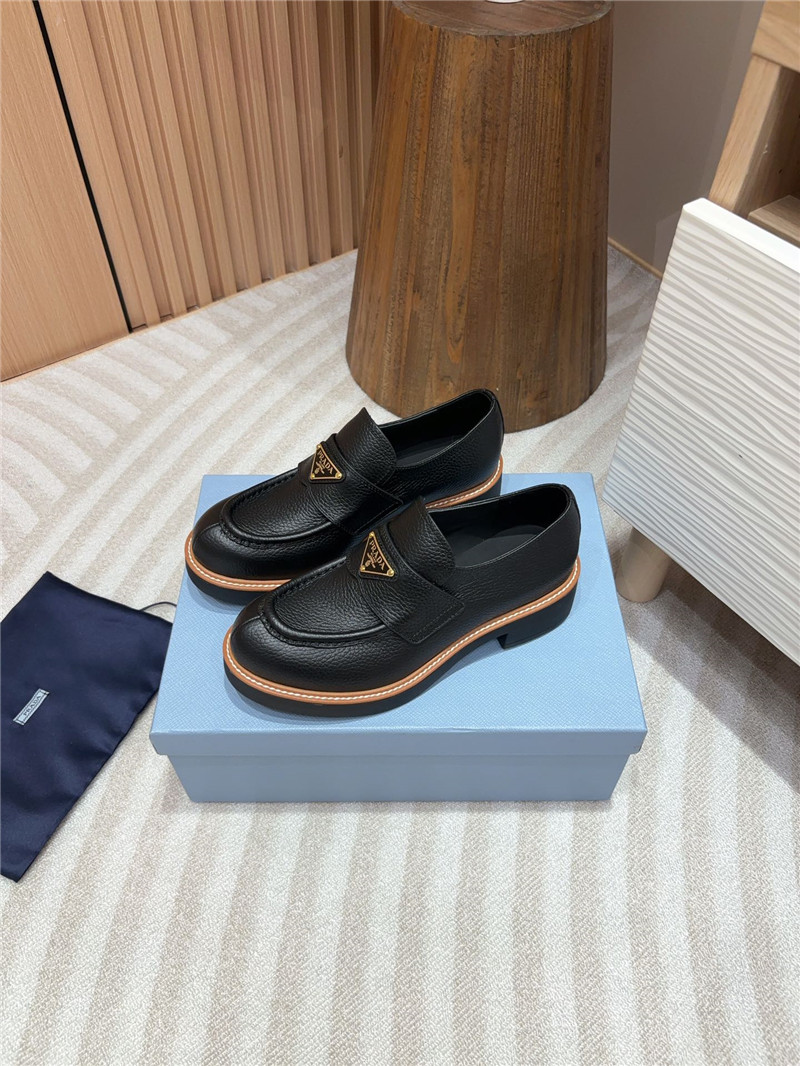 Pra*a black double chocolate leather loafers