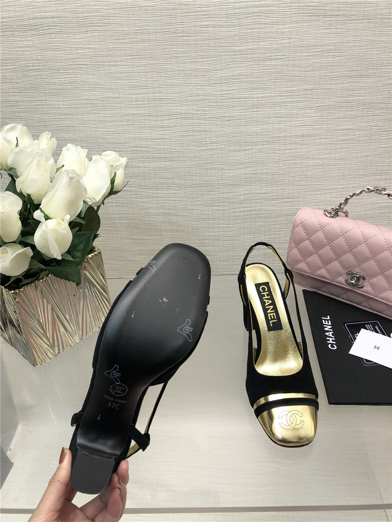 Ch**el black suede and gold leather slingbacks