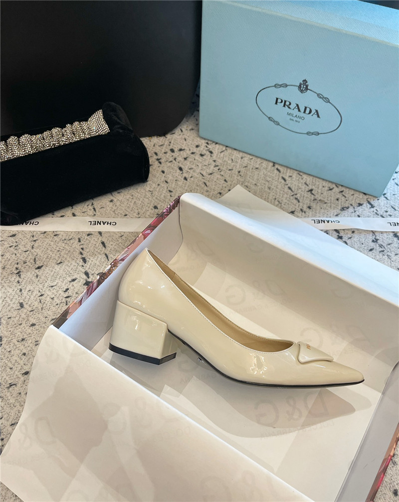 Pra*a triangle logo ivory brushed leather pumps