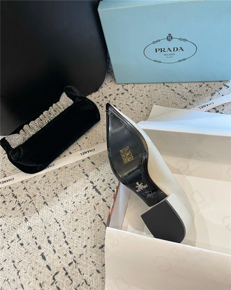Pra*a triangle logo ivory brushed leather pumps