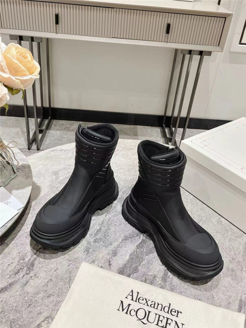 a1exa*der Mcqv*en black tread slick high top sneakers