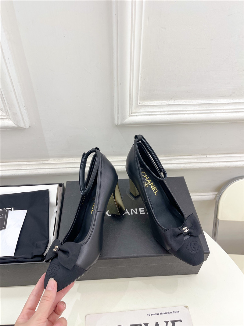 Ch**el bow mary jane heel pumps in black calfskin
