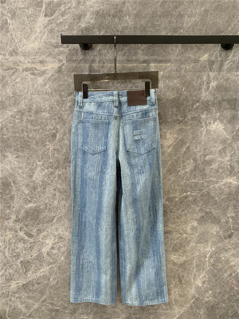 M1um1u striped tie-dye denim trousers