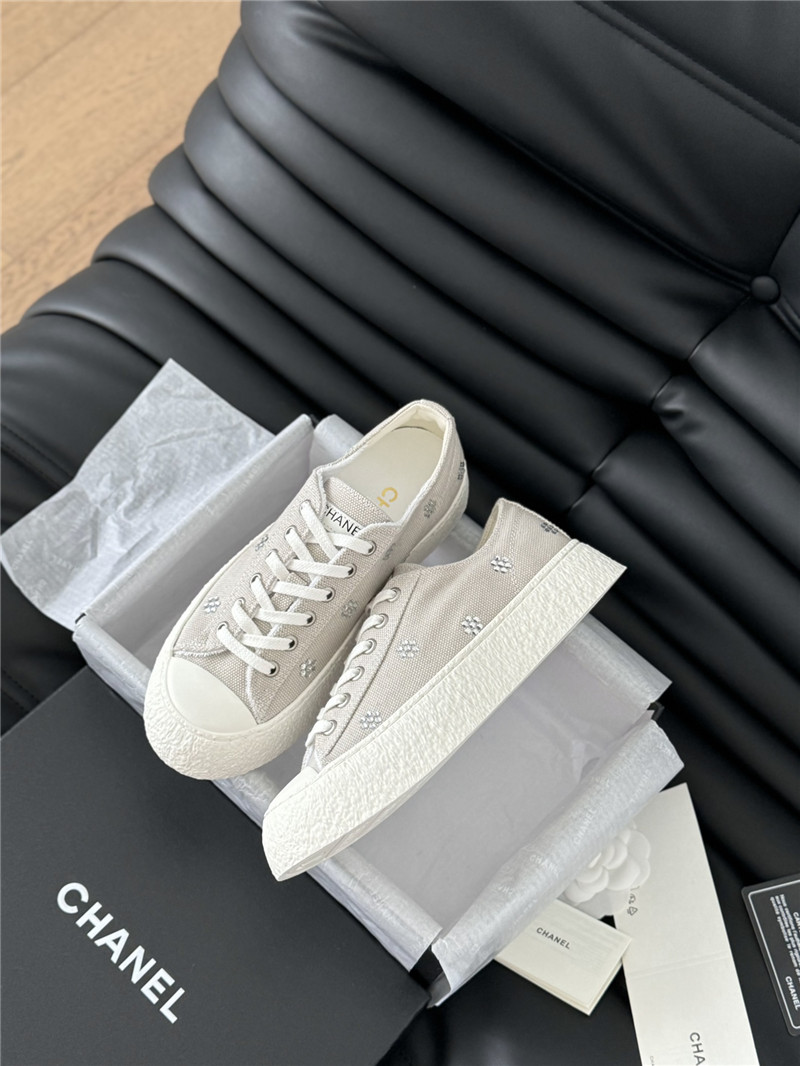 Ch**el beige lace-up low top canvas sneakers