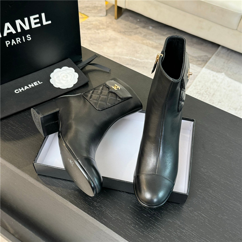 Ch**el black calfskin cap toe ankle boots