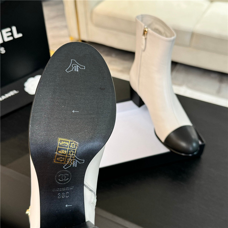 Ch**el calfskin cap toe ankle boots in white
