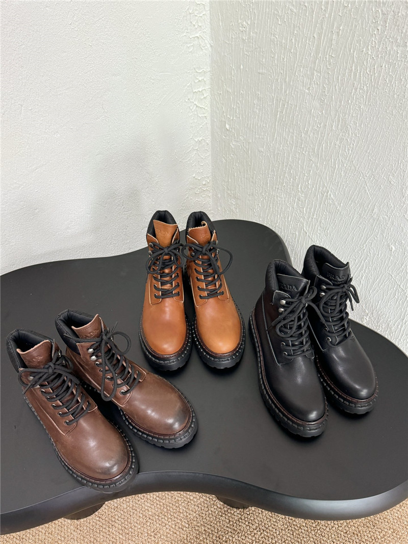 Pra*a black leather and re-nylon booties