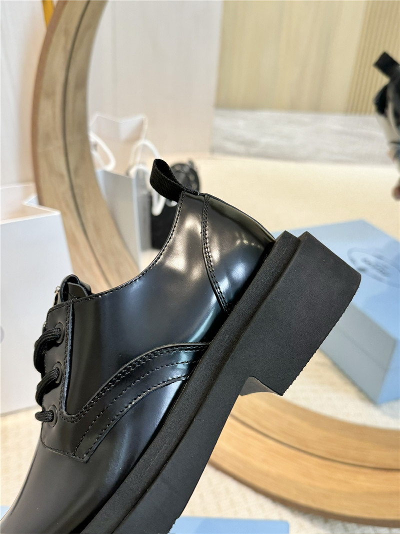 Pra*a leather triangle logo loafers