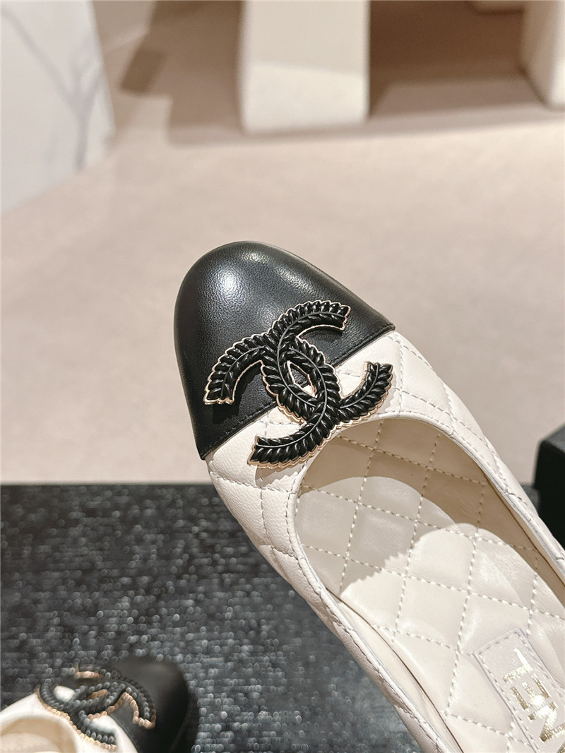 Ch**el white/black quilted leather cap toe pumps