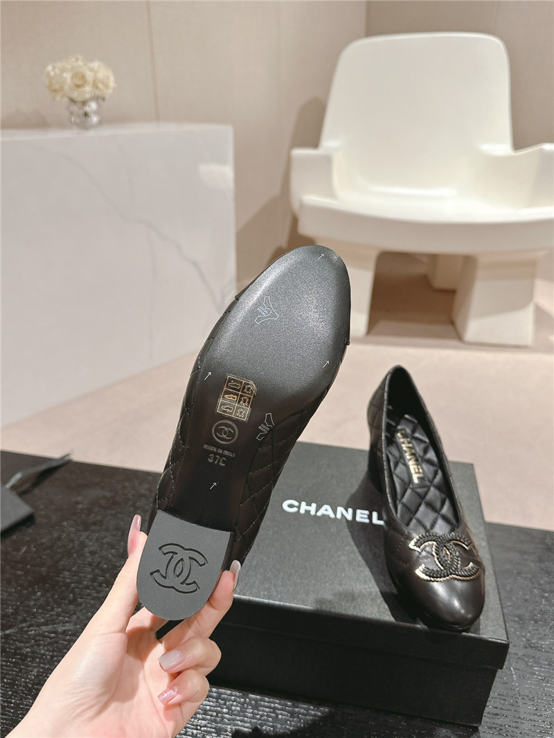 Ch**el black quilted leather cap toe pumps