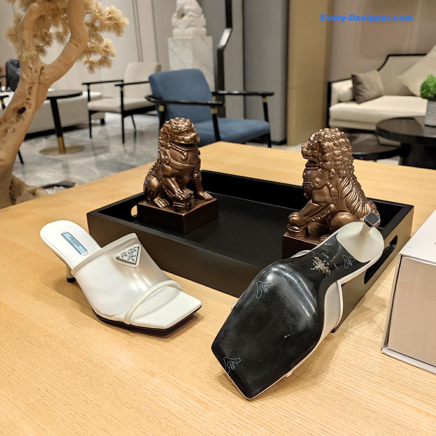 Pra*a metal logo triangle head square sandals