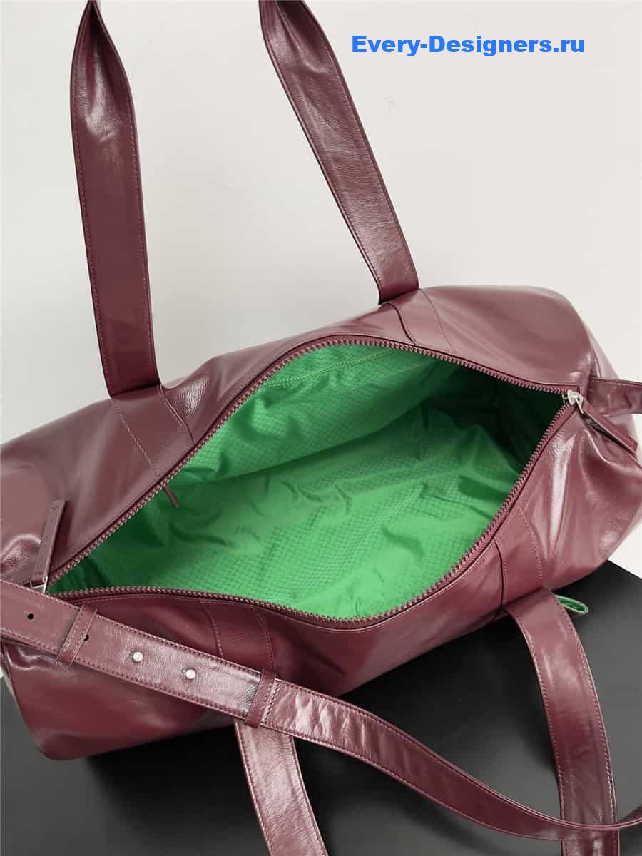 b0tt*ga Ven*ta wine red leather travel bag