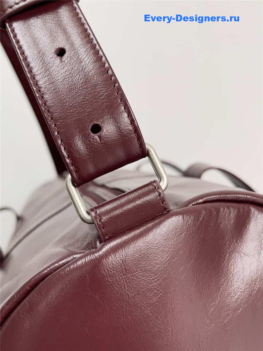 b0tt*ga Ven*ta wine red leather travel bag