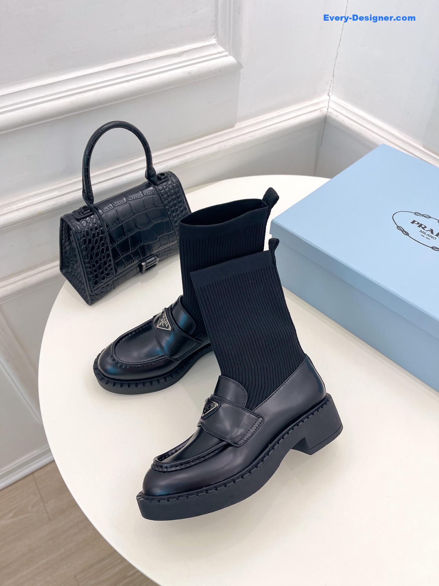 Pra*a catwalk style thick-soled triangle logo socks ankle boots
