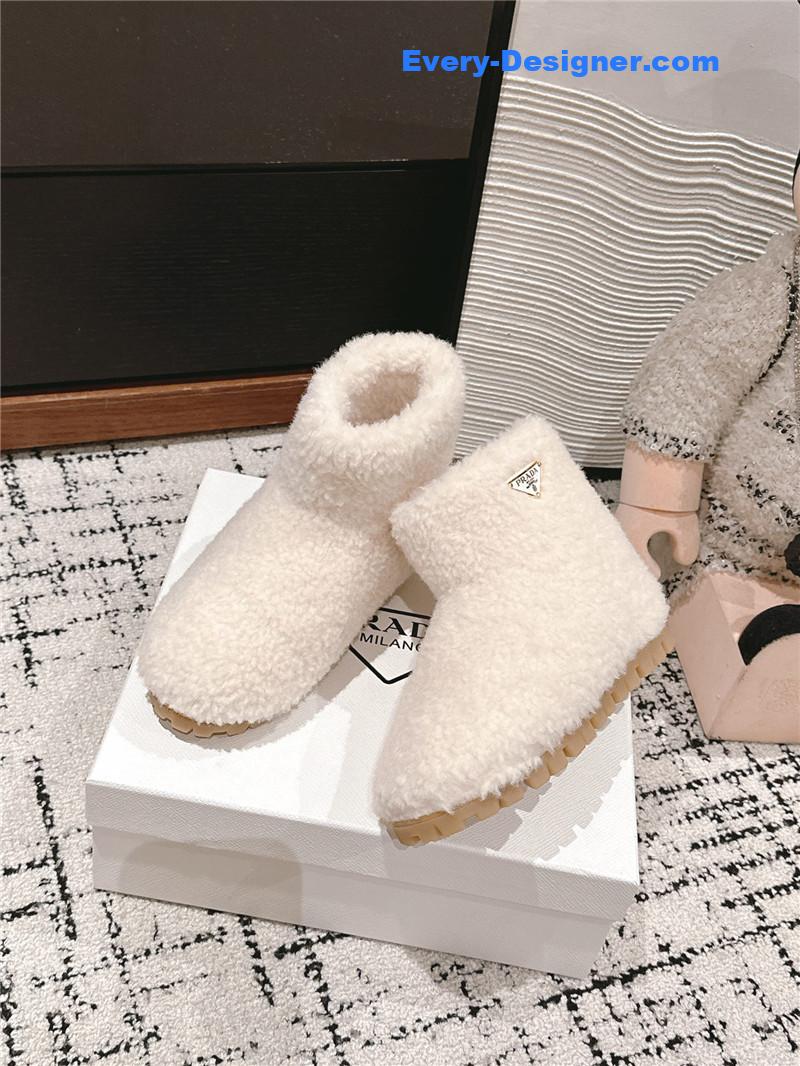 Pra*a white shearling booties