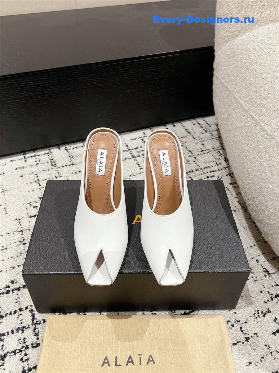 Alaia White Spike Mules in Calfskin