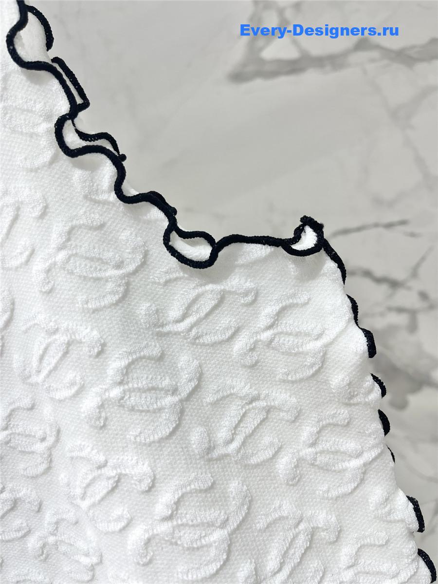 Ch**el embroidered wool-silk top in white