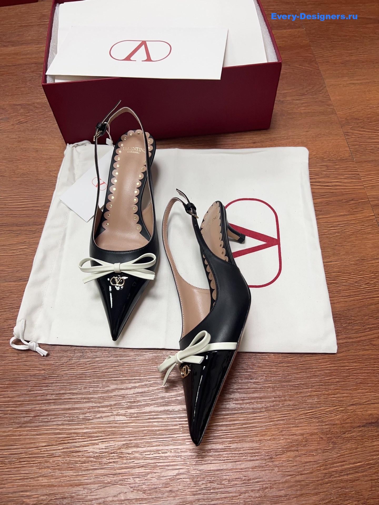 Va1e*ntin0 garavani bow slingback pumps in black
