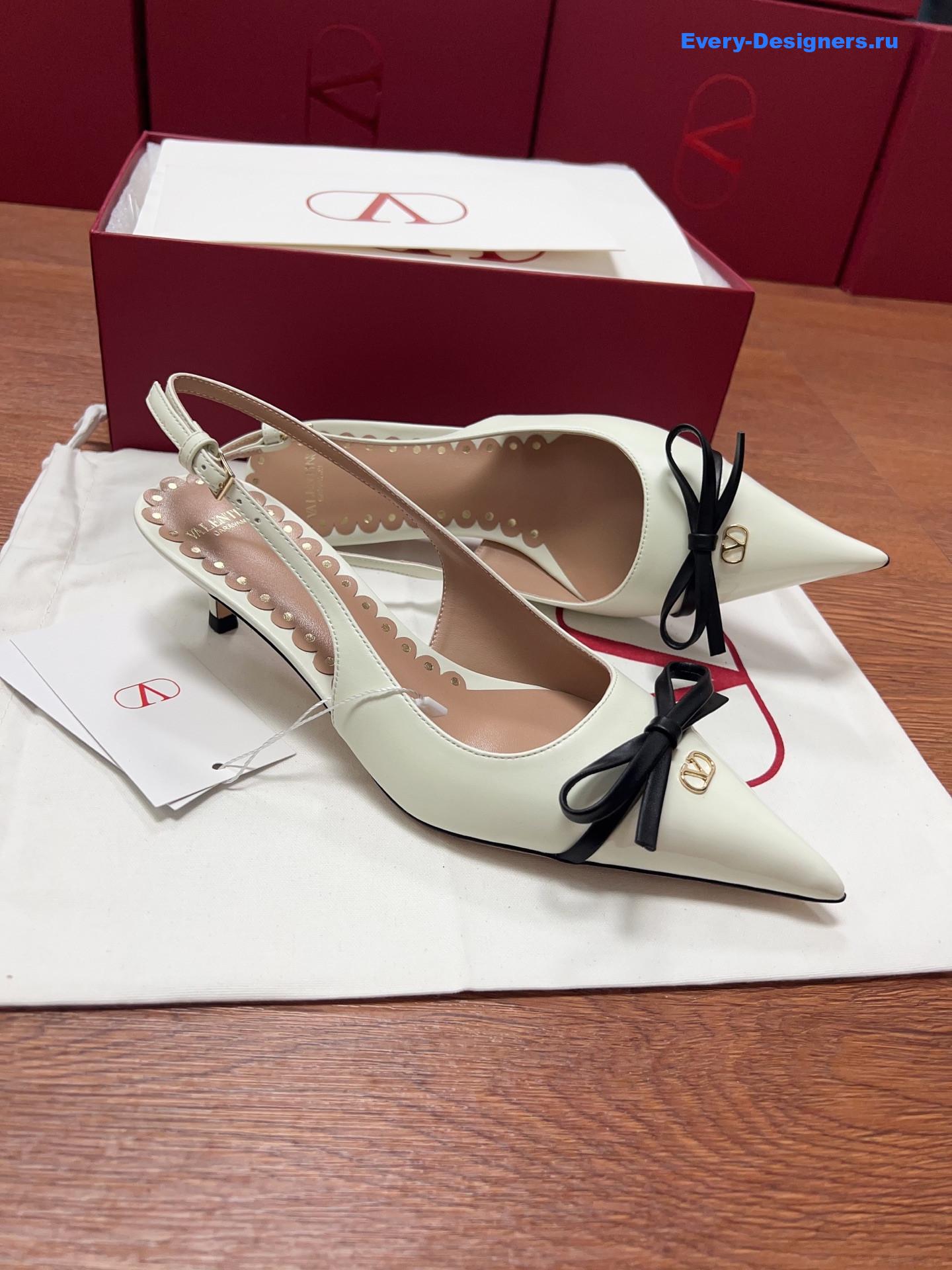 Va1e*ntin0 garavani white bow slingback pumps