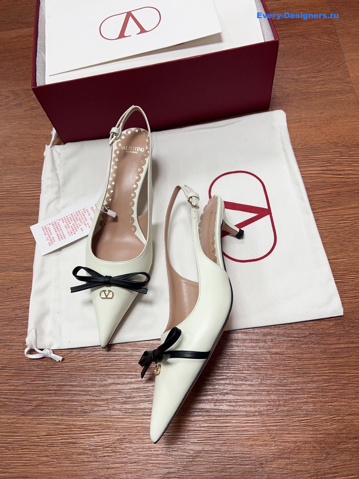 Va1e*ntin0 garavani white bow slingback pumps
