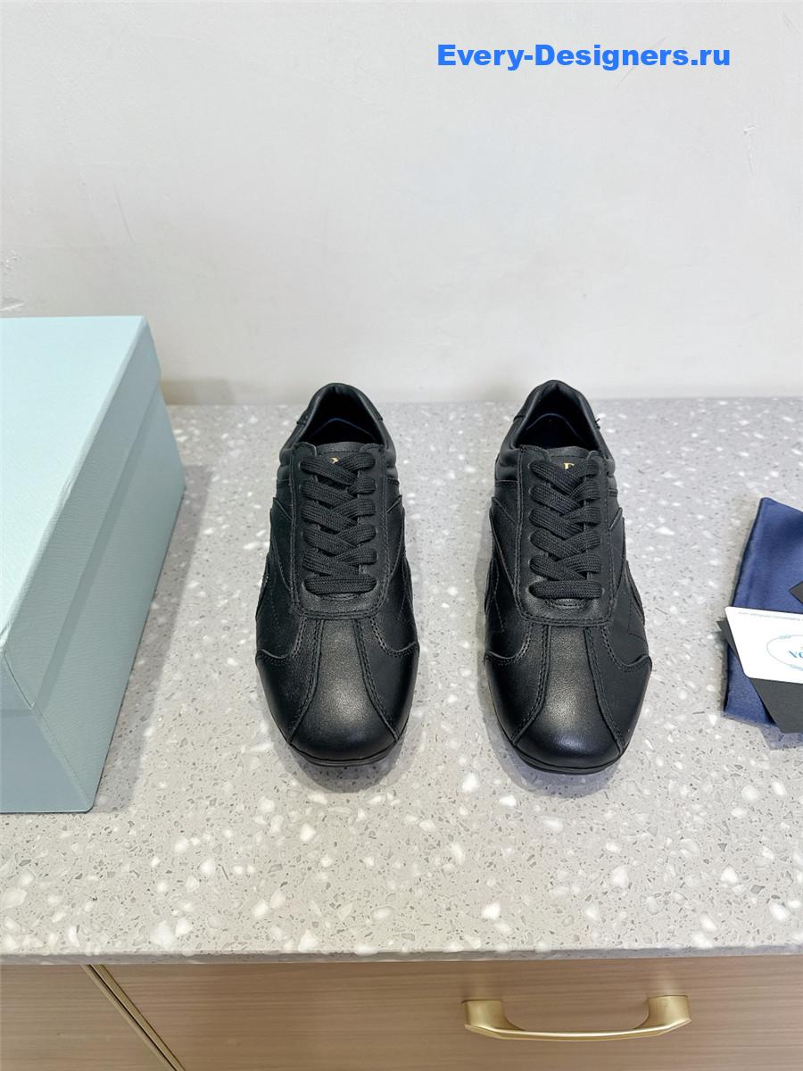 Pra*a black leather low-top sneakers