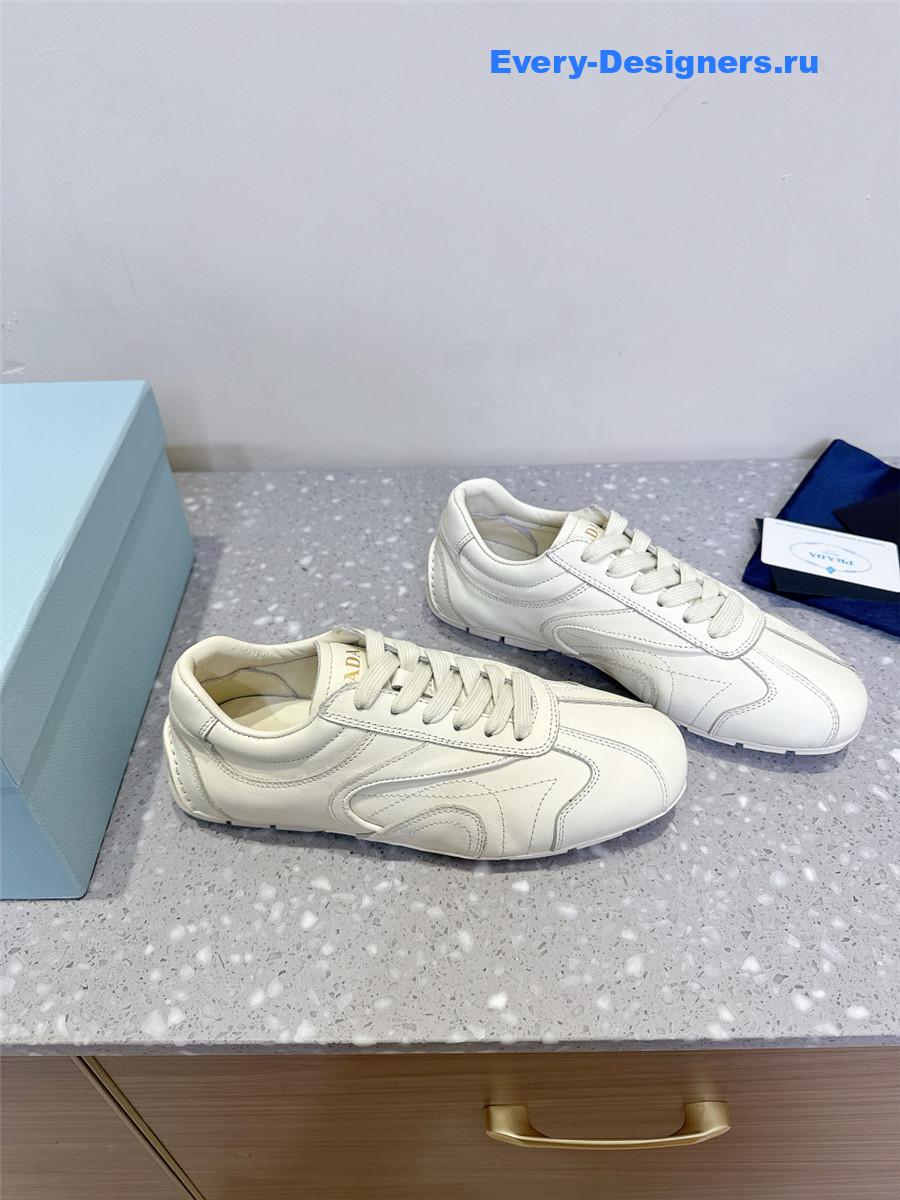 Pra*a white leather low-top sneakers