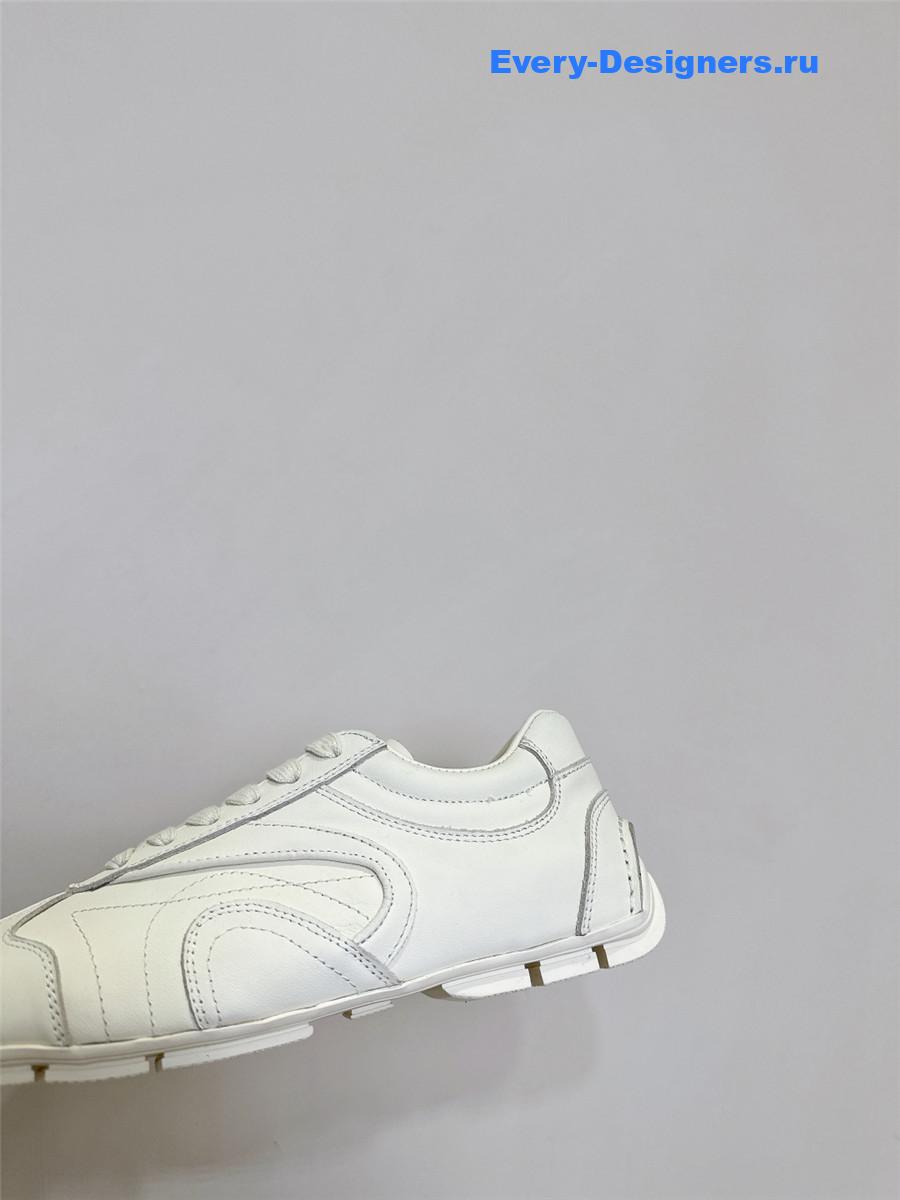 Pra*a white leather low-top sneakers