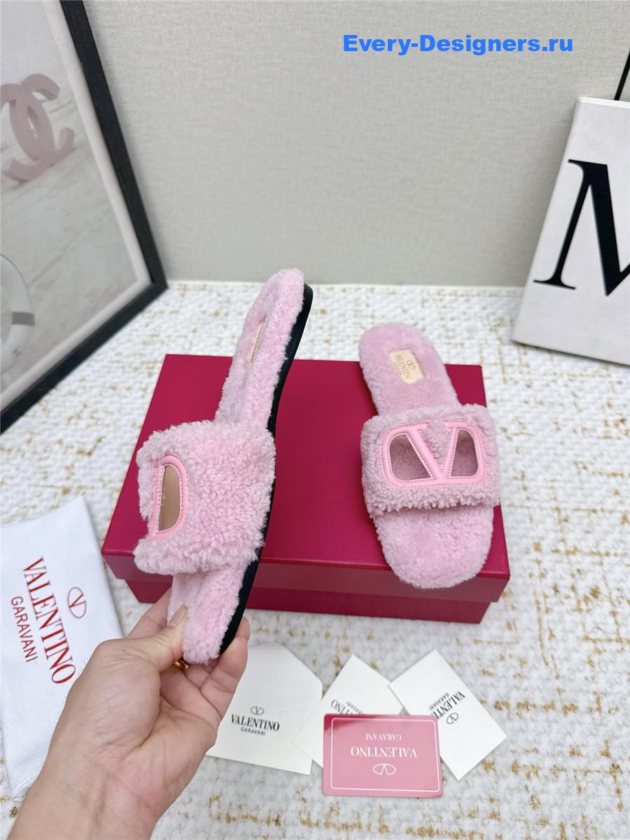 Va1e*ntin0 pink vlogo cutout faux shearling slides